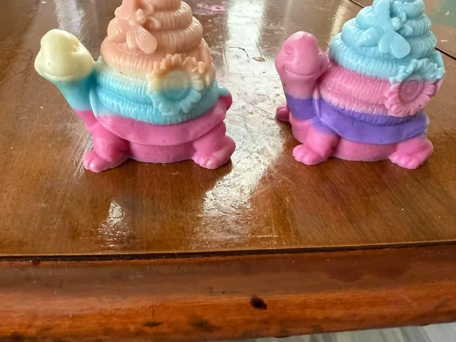 Two colorful turtle-shaped soaps